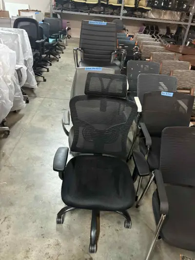 Black mesh chair with headrest at Peach State Office Furniture, Atlanta