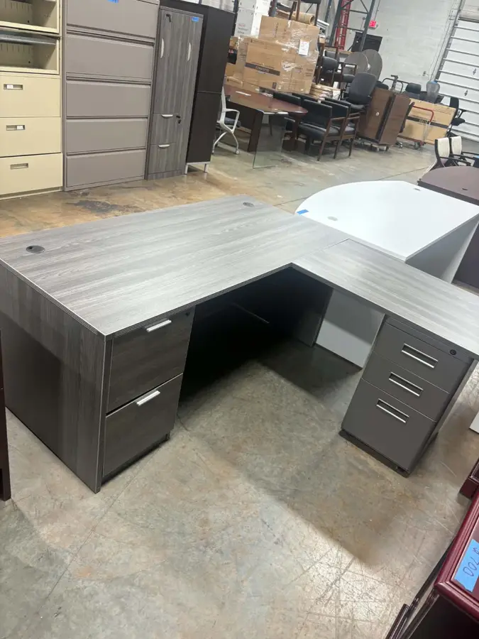 Grey L shaped desk with 1 set of metal drawers at Peach State Office Furniture, Atlanta